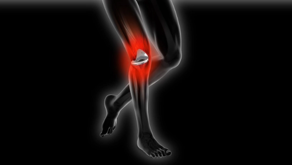 Drawn legs with knee prosthesis with red area around symbolizing pain